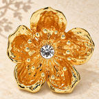 Textured Plum Blossom with Faceted Center Brooch — styled background
