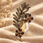 Vintage-Style Jeweled Leaf with Oval Stone Brooch — styled background