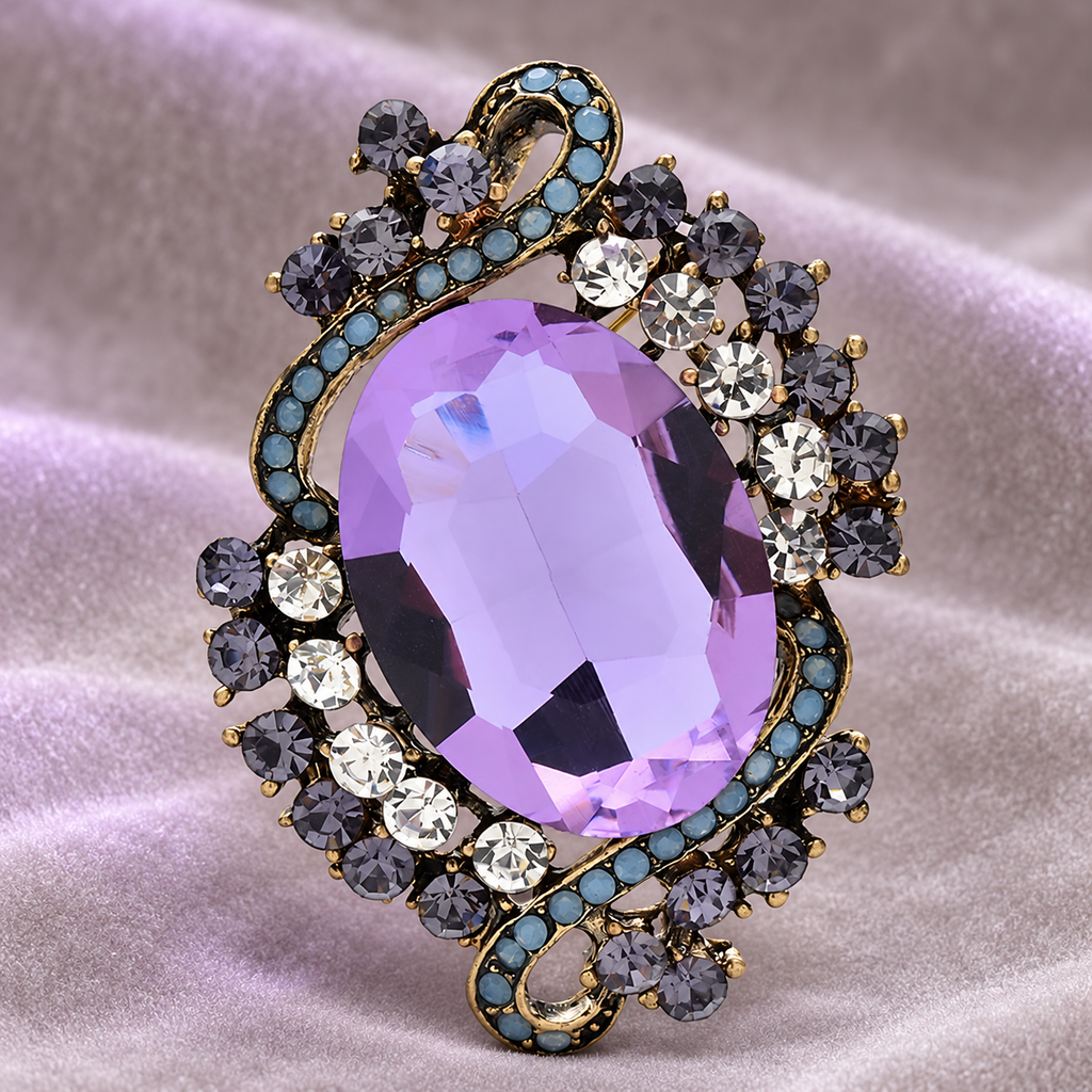 Vintage-Style Faceted Oval with Ribbon Frame Brooch — styled background