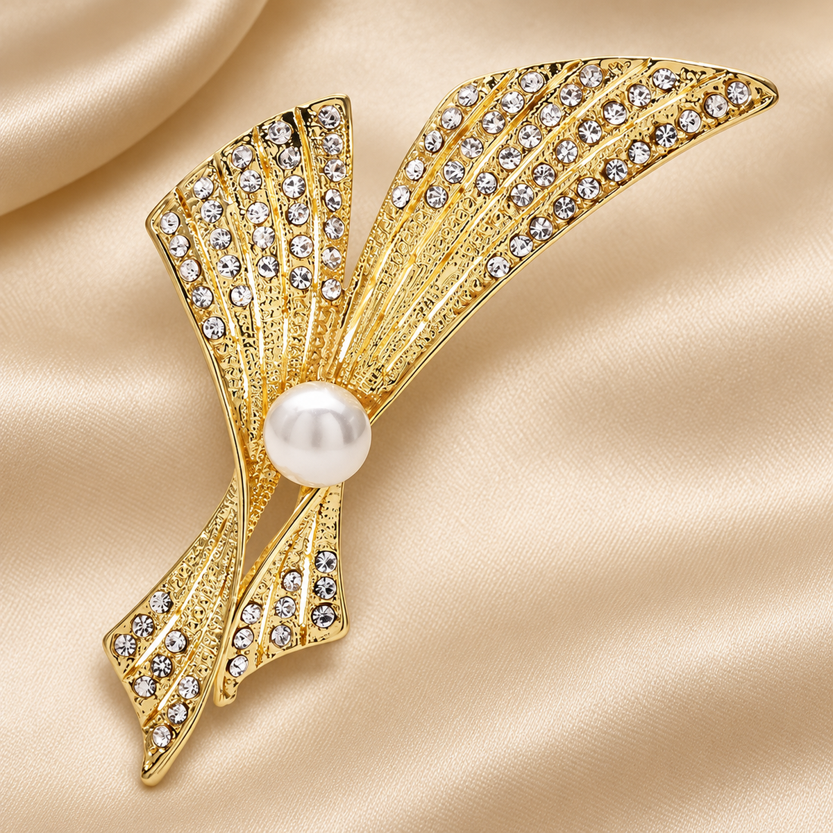 Rhinestone Ribbon Bow with Pearl-Look Center Brooch — styled background