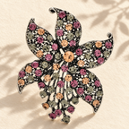 Vintage-Style Jeweled Flower with Pointed Petals Brooch — styled background