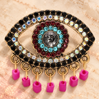 Jeweled Eye with Pink Bead Fringe Brooch — styled background