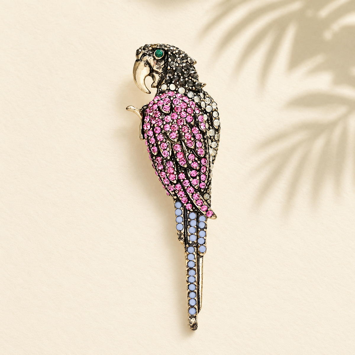 Pink Rhinestone Parrot with Long Tail Brooch — styled background