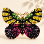 Petite Multicolor Rhinestone Butterfly Brooch — styled background
