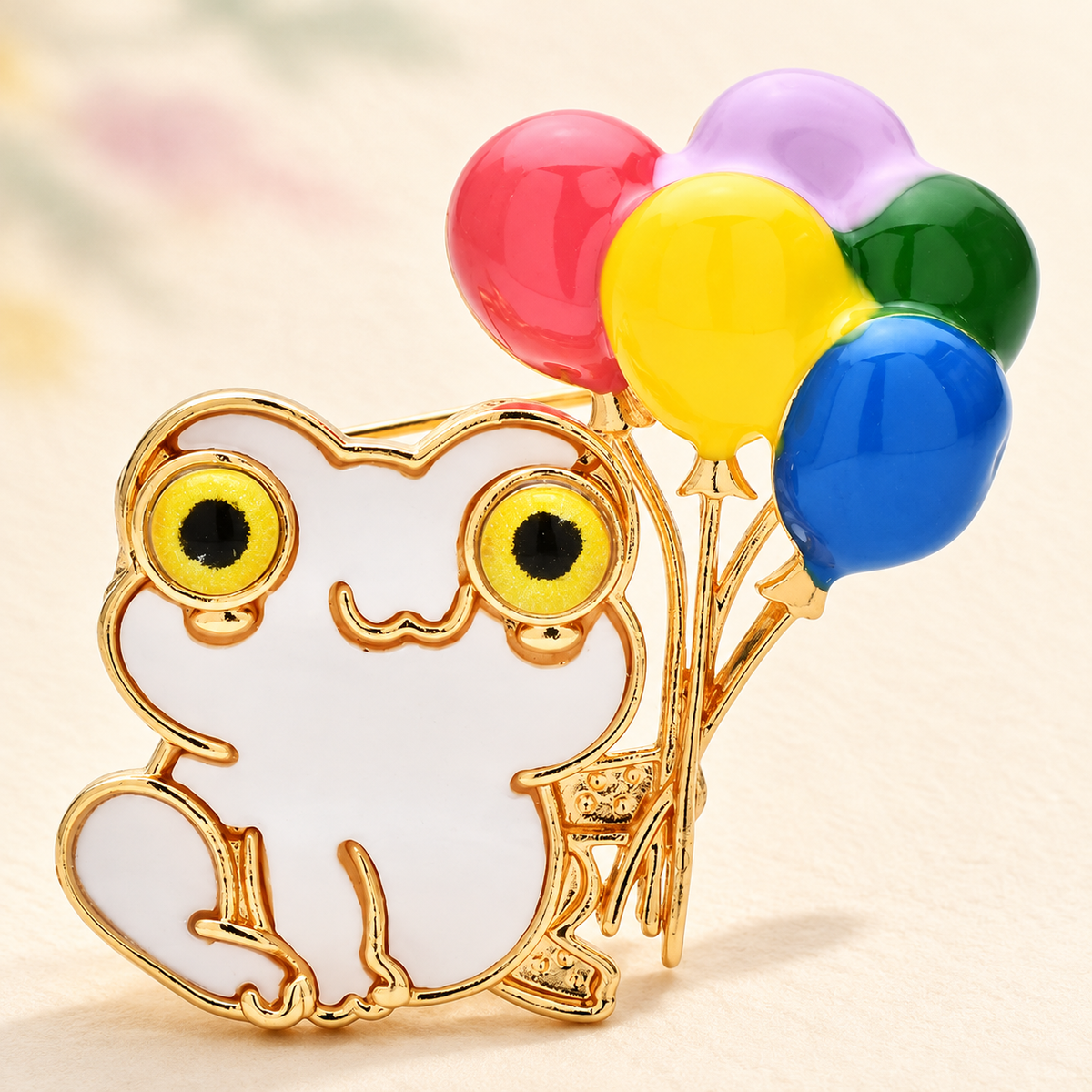 Enamel Frog Holding Colorful Balloons Brooch — styled background