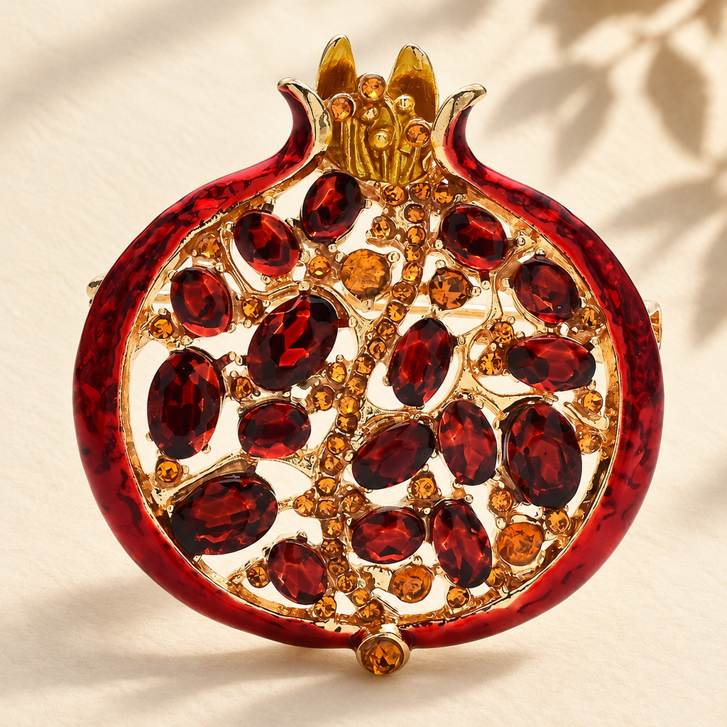 Jeweled Pomegranate with Enamel Rim Brooch — styled background