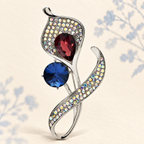 Faceted Calla Lily with Jeweled Curved Leaves Brooch — styled background