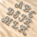 Rhinestone Script Initial Letter Brooch — styled background