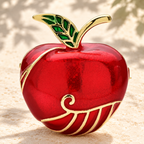 Glossy Red Enamel Apple Brooch — styled background