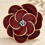 Deep Red Enamel Camellia Brooch — styled background