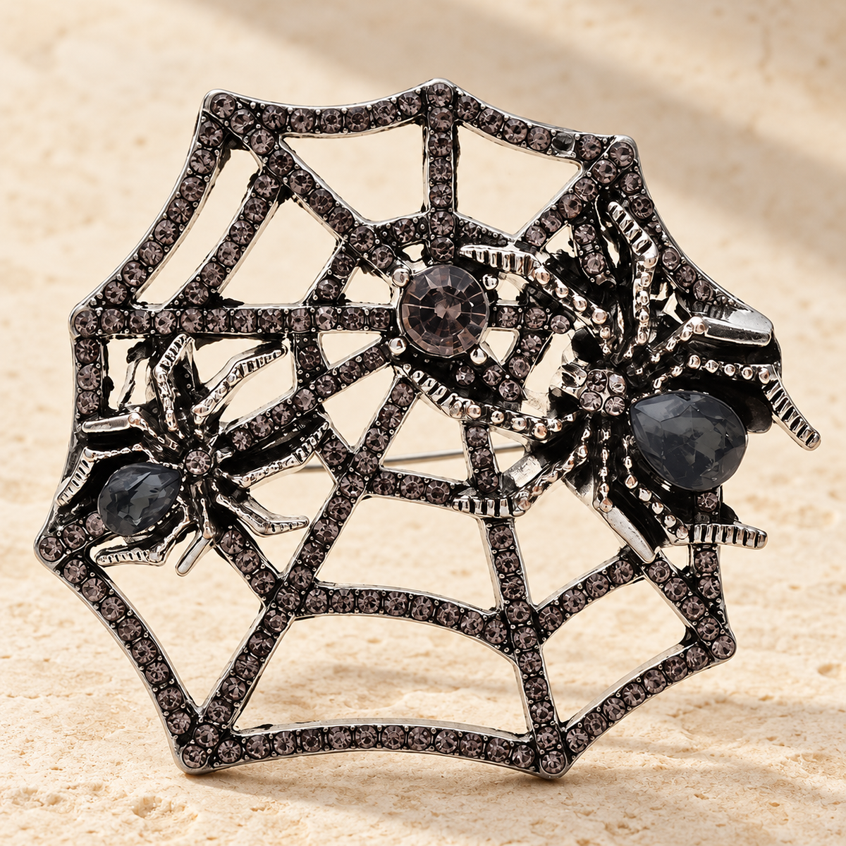 Spider on Rhinestone Web Brooch — styled background