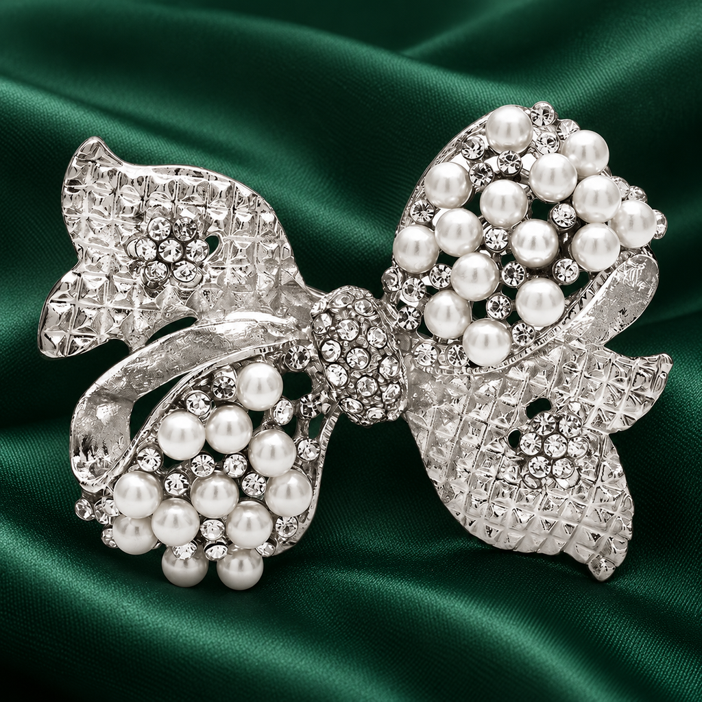 Rhinestone Bow with Pearl-Look Accents Brooch — styled background