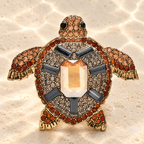 Amber-Tone Rhinestone Sea Turtle Brooch — styled background