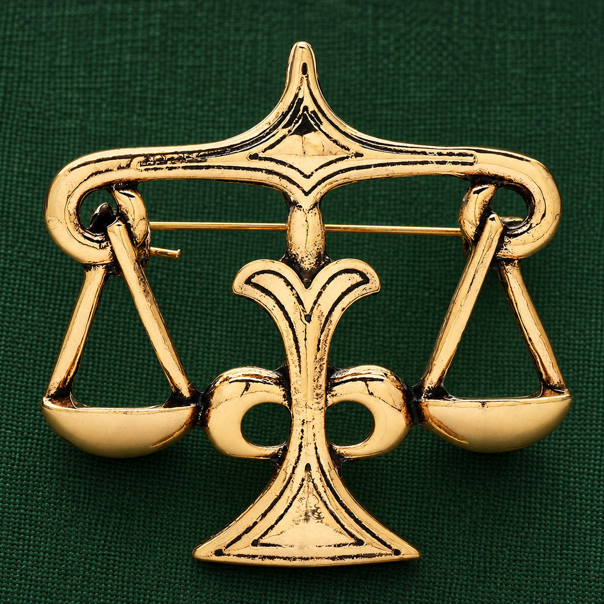 Sculpted Balance Scales Brooch — styled background