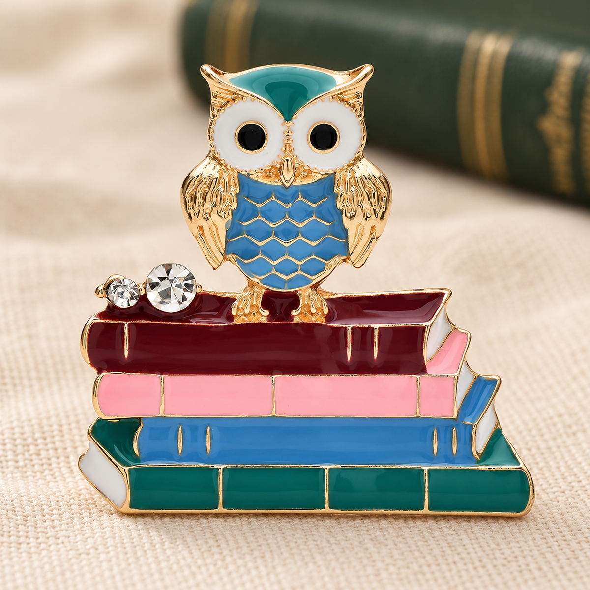 Enamel Owl on a Stack of Books Brooch — styled background