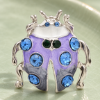 Lavender Enamel Ladybug with Blue Stones Brooch — styled background