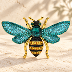 Rhinestone Bee with Spread Wings Brooch — styled background