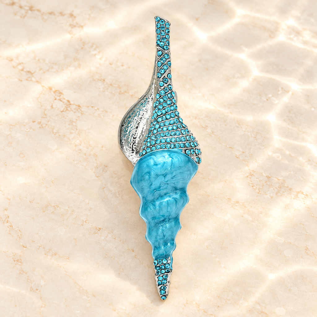 Long Enamel Conch Shell with Rhinestones Brooch — styled background