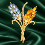 Faceted Wheat Sheaf Brooch — styled background