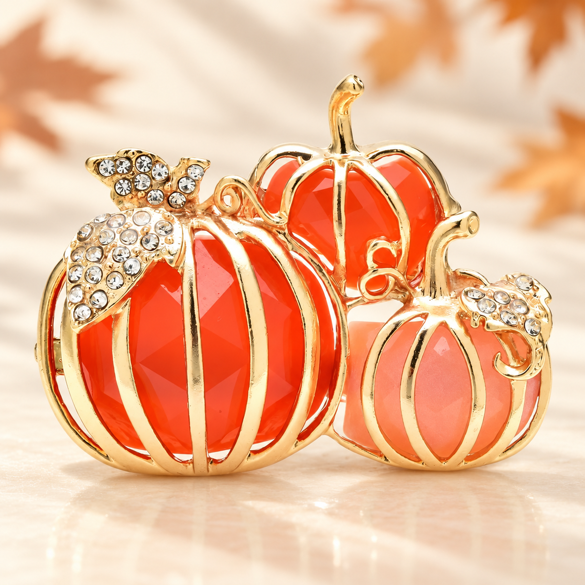 Enamel Pumpkin Trio Brooch — styled background