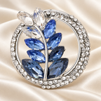 Jeweled Wheat Wreath Brooch — styled background