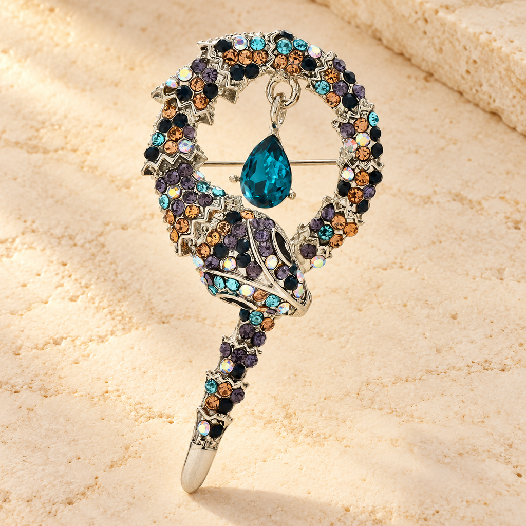 Coiled Rhinestone Snake Brooch — styled background