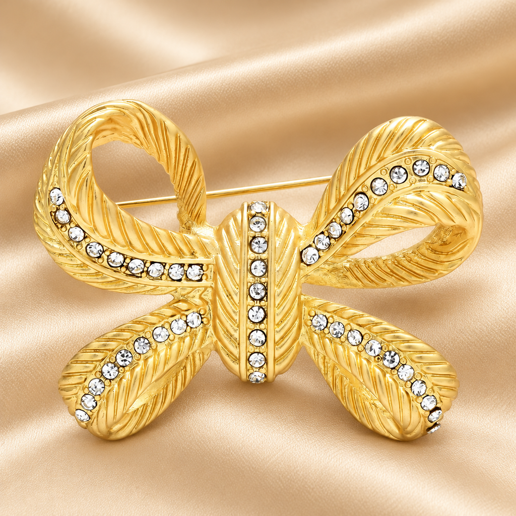 Textured Bow with Rhinestone Ribbons Brooch — styled background