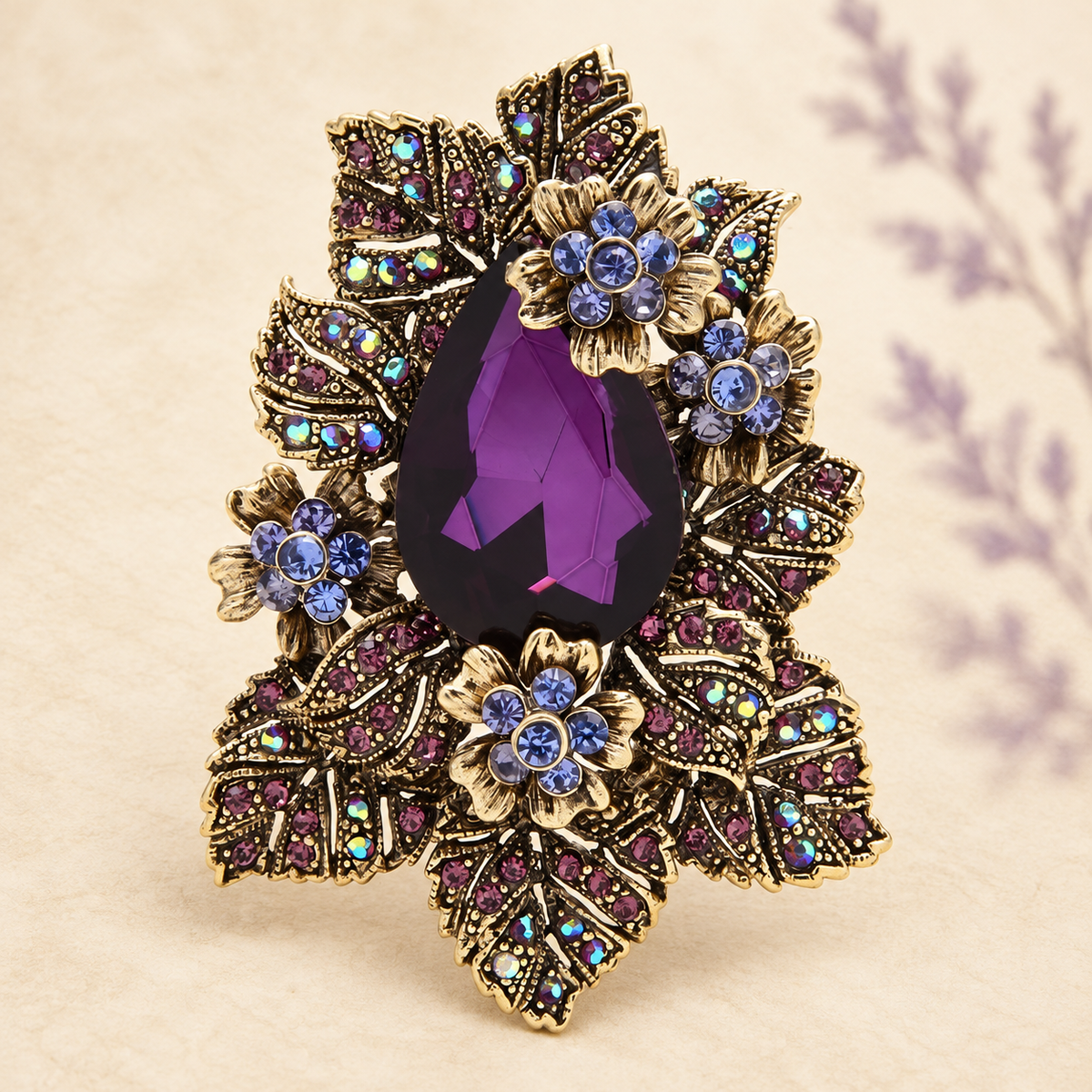 Vintage-Style Floral Cluster with Teardrop Center Brooch — styled background