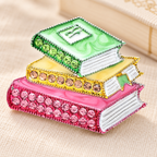 Enamel Stacked Books with Rhinestones Brooch — styled background