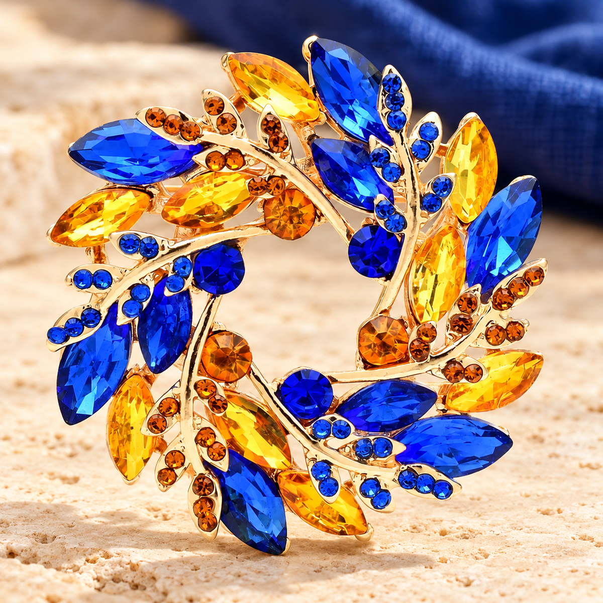 Jeweled Olive Wreath Brooch — styled background