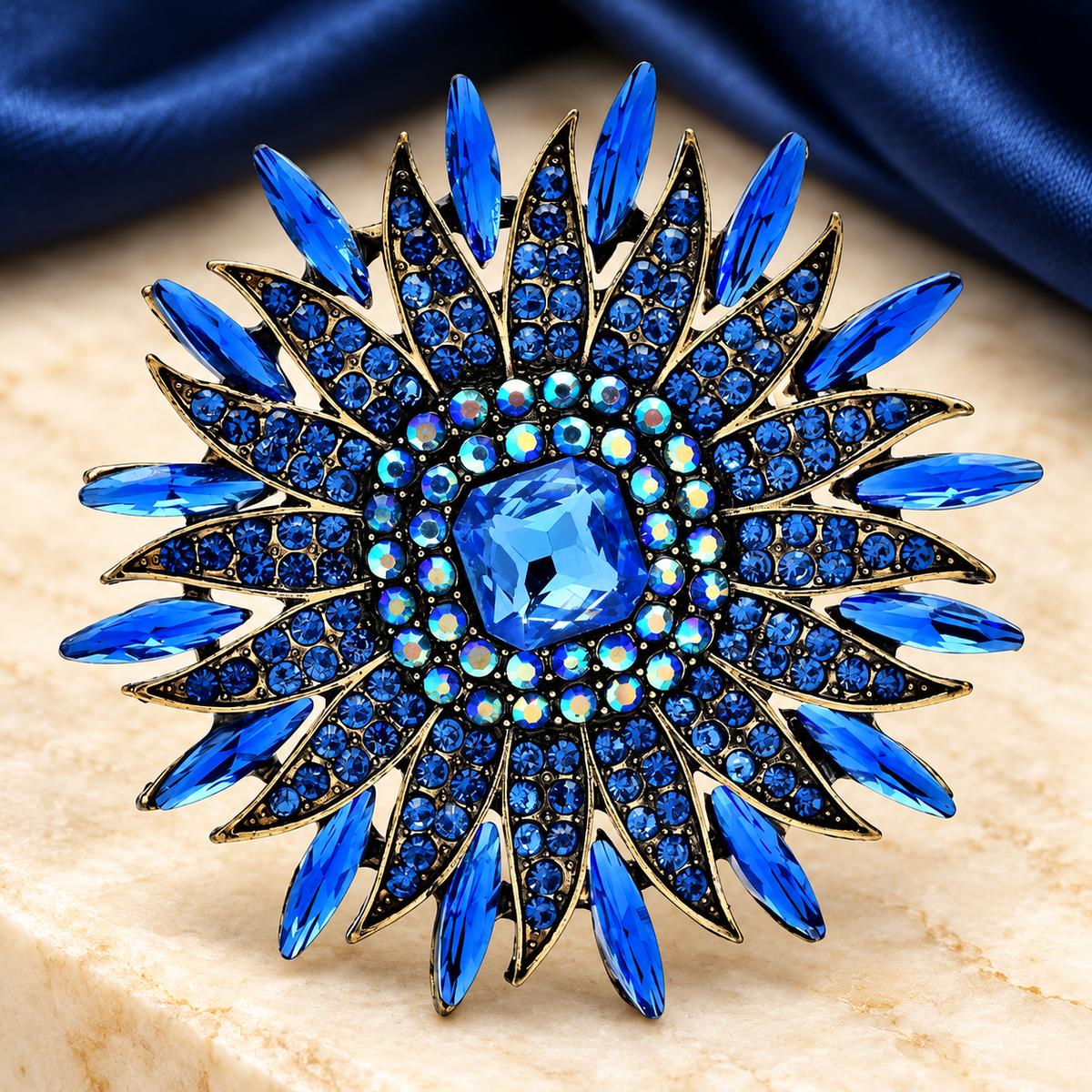 Radiant Rhinestone Sunburst Brooch — styled background
