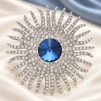 Jeweled Sunburst with Round Center Brooch — styled background