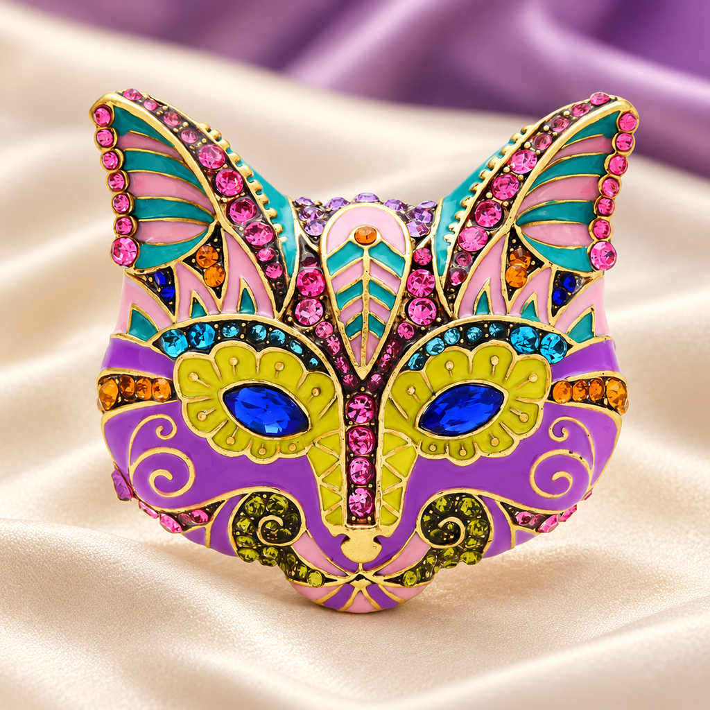 Ornate Enamel Cat Face with Blue Eyes Brooch — styled background