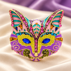Ornate Enamel Cat Face with Blue Eyes Brooch — styled background