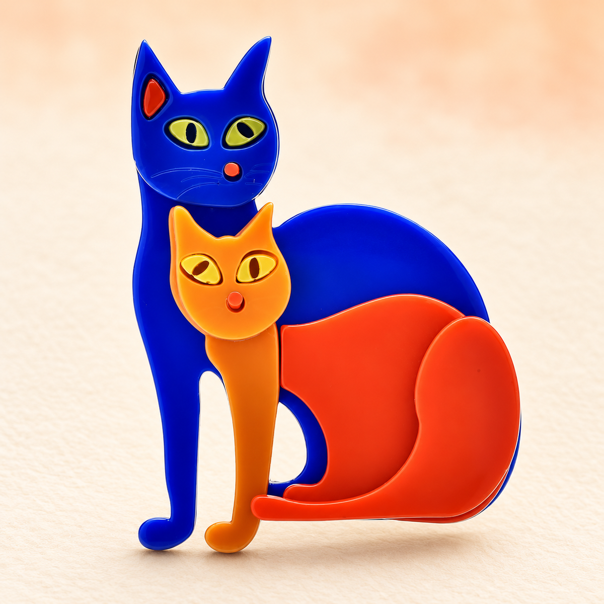 Two Sitting Cats Acrylic Brooch — styled background