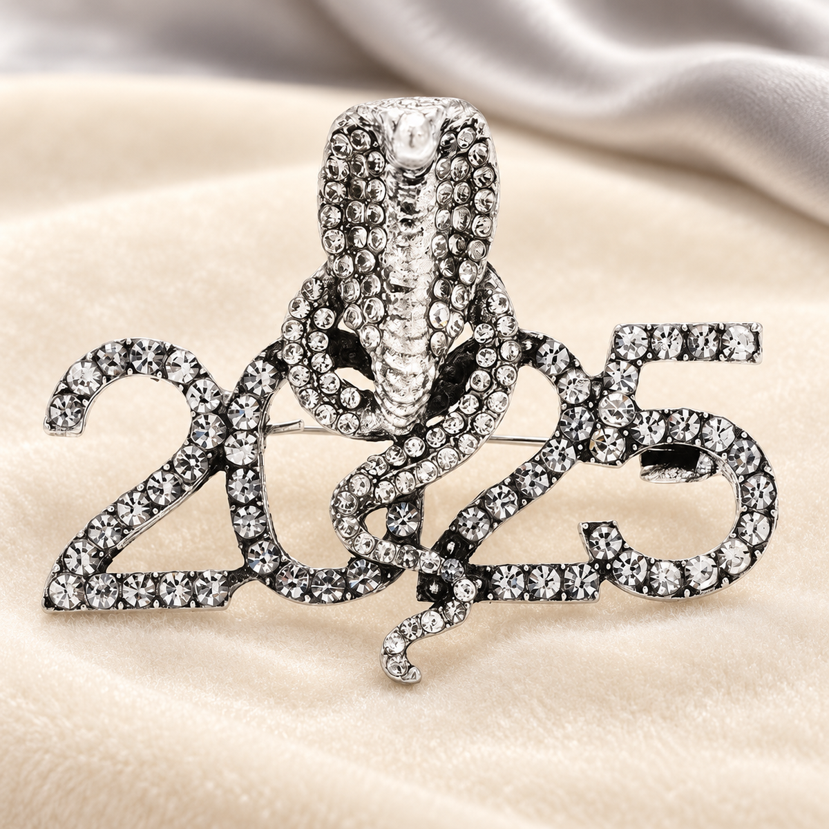 Rhinestone Cobra with 2025 Numerals Brooch — styled background