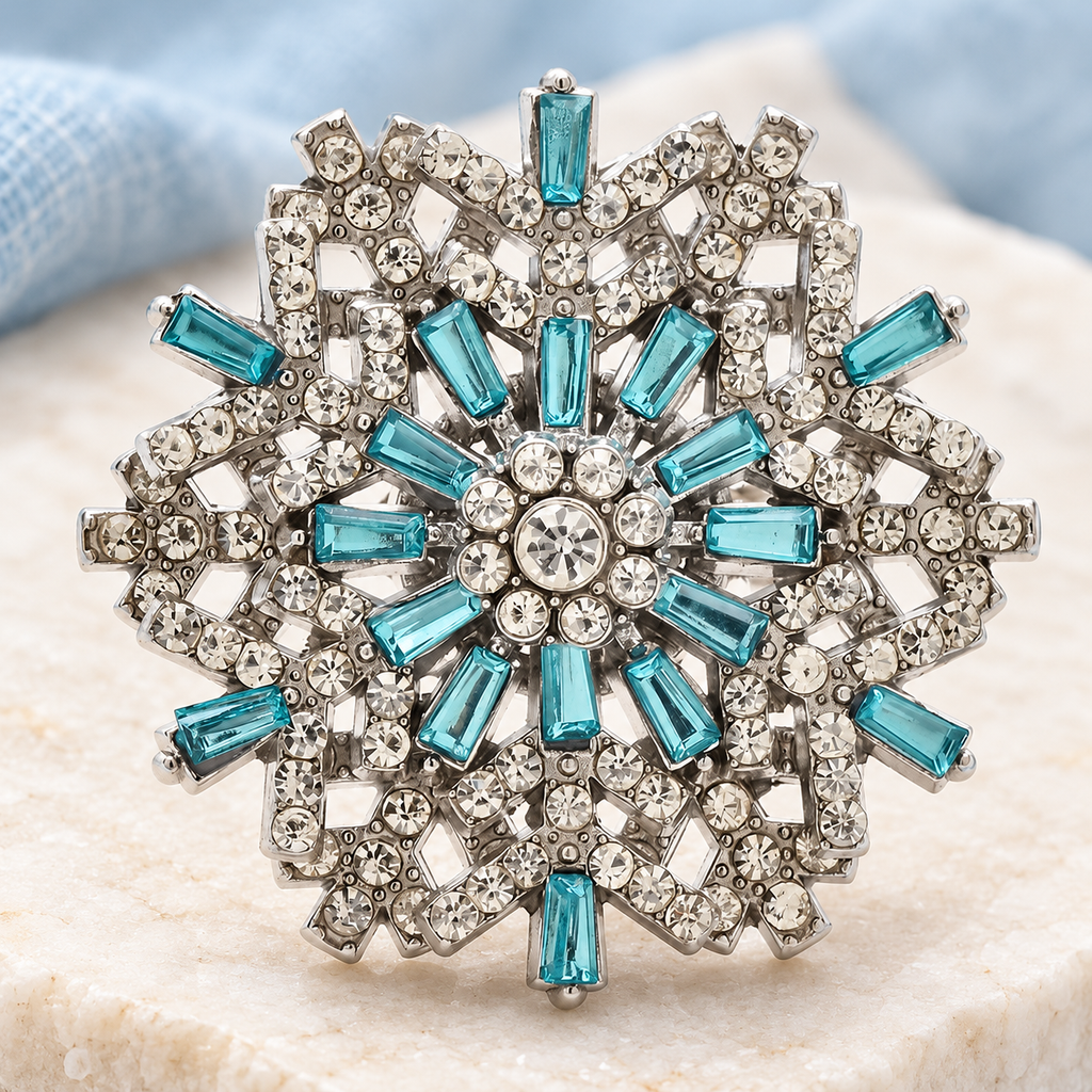Jeweled Snowflake with Baguette Accents Brooch — styled background