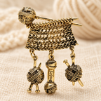 Knitting Needles with Dangling Yarn Balls Brooch — styled background