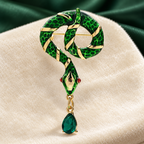 Looped Enamel Snake with Teardrop Pendant Brooch — styled background