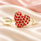 Cupid Arrow and Heart Brooch — styled background