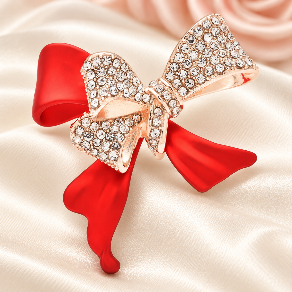 Red Enamel Bow with Rhinestone Loops Brooch — styled background
