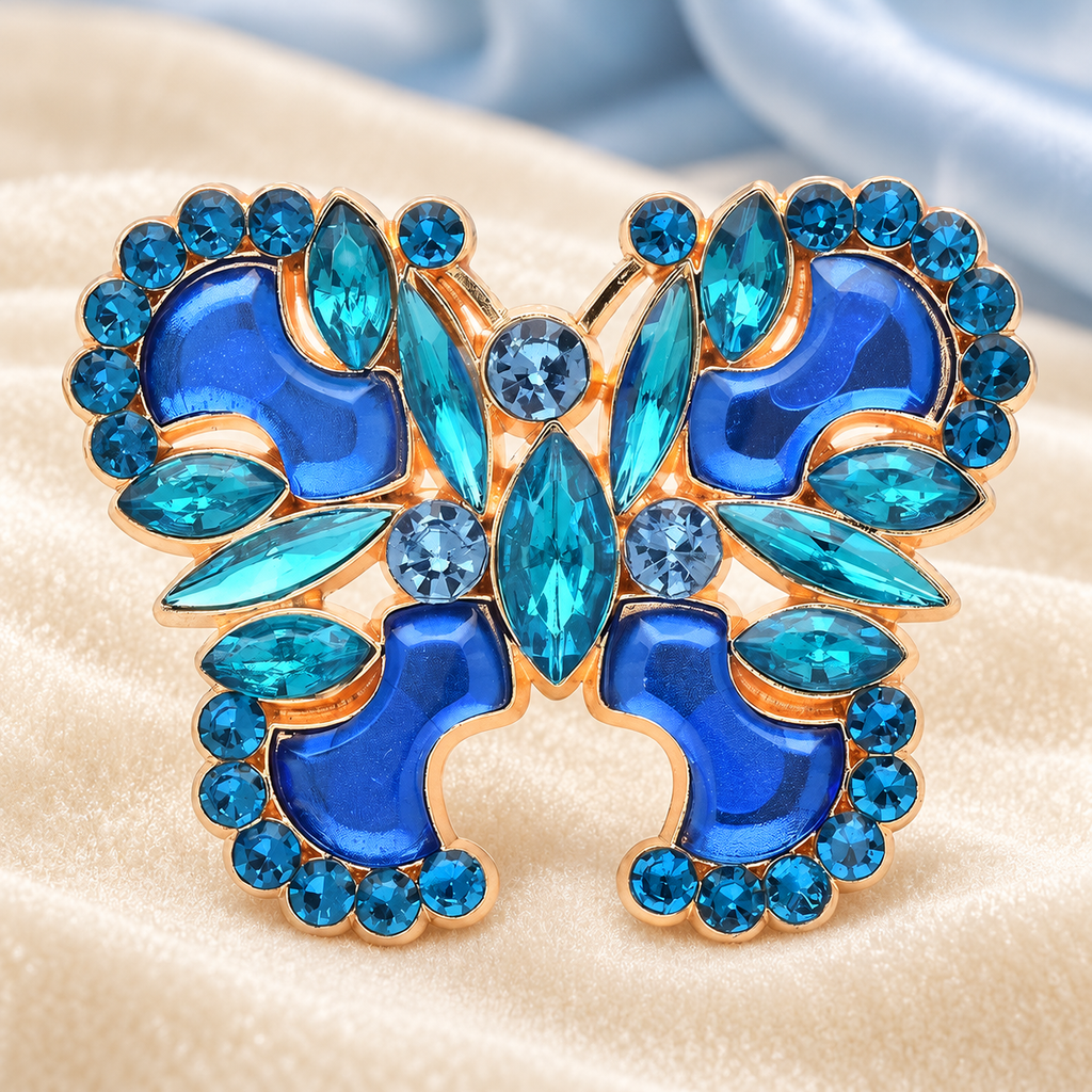 Ornate Faceted Butterfly Brooch — styled background