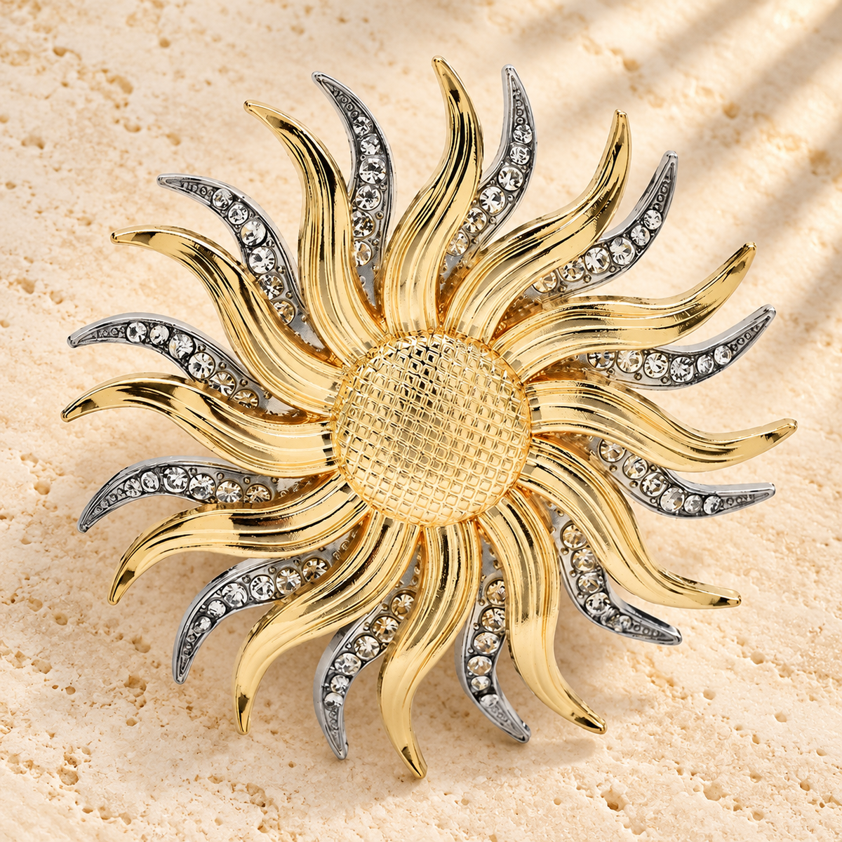 Layered Sun with Rhinestone Rays Brooch — styled background