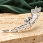 Flowing Abstract Female Silhouette Brooch — styled background