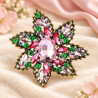 Large Layered Jeweled Star Flower Brooch — styled background