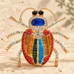 Multicolor Rhinestone Beetle Brooch — styled background