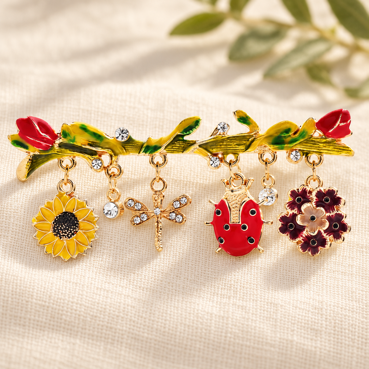 Enamel Branch with Flower and Insect Charms Brooch — styled background