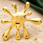 Polished Abstract Splash Brooch — styled background