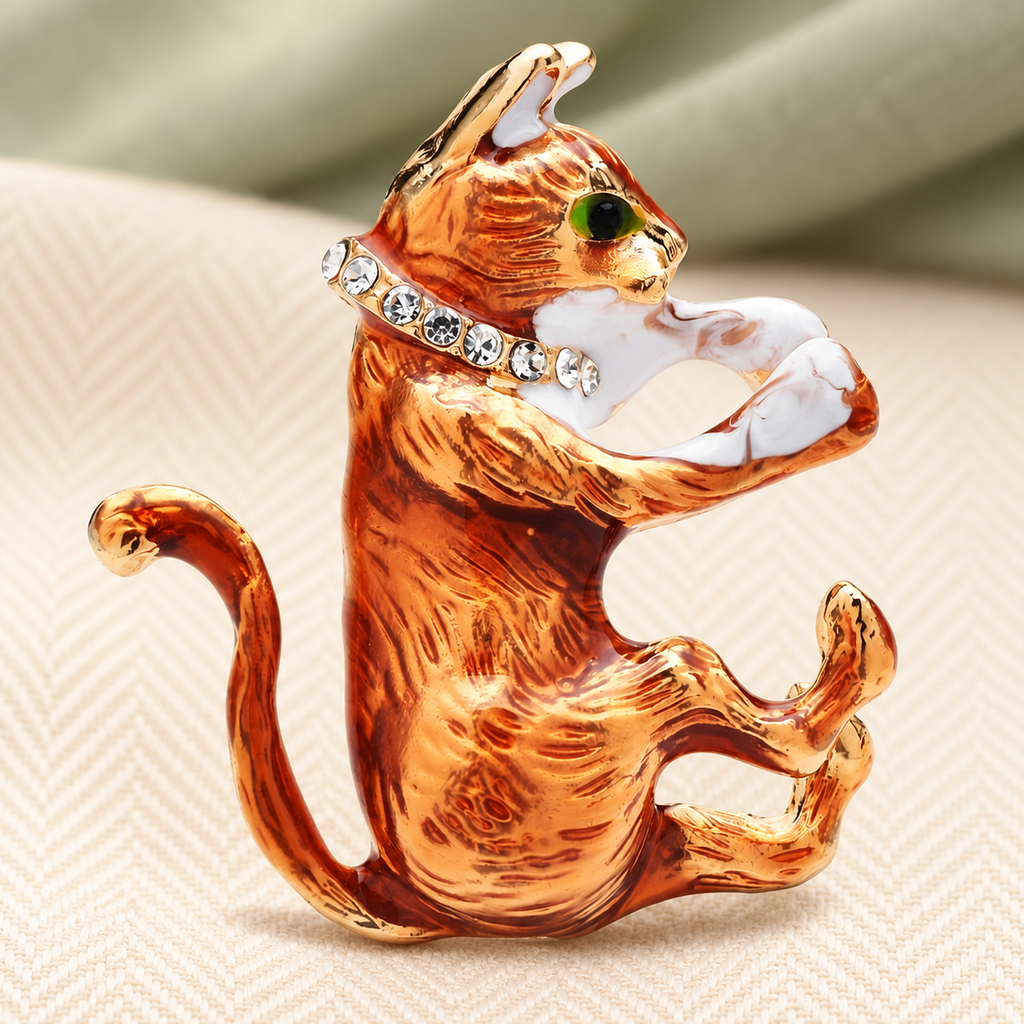 Orange Cat Grooming Its Paw Brooch — styled background