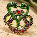 Intertwined Enamel Snake Pair Brooch — styled background